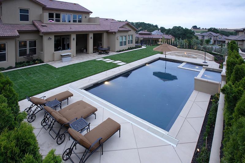 Concrete pool deck with slide, Hamilton ON